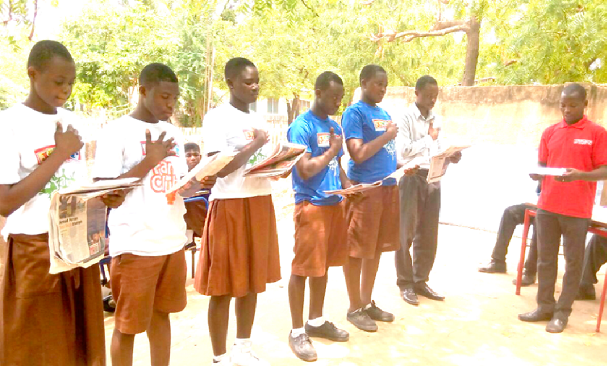 Mr Benjamin Xornam Glover, a Senior Reporter of the GCGL swearing in the five-member executive of the Manye Foundation School Junior Graphic Fan Club